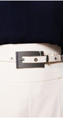 Close-up of a person wearing an ivory Luna Fashion House  belt with a decorative buckle on a plain background