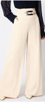 Beige wide-leg Luna Fashion House pants worn with a dark top on a white background