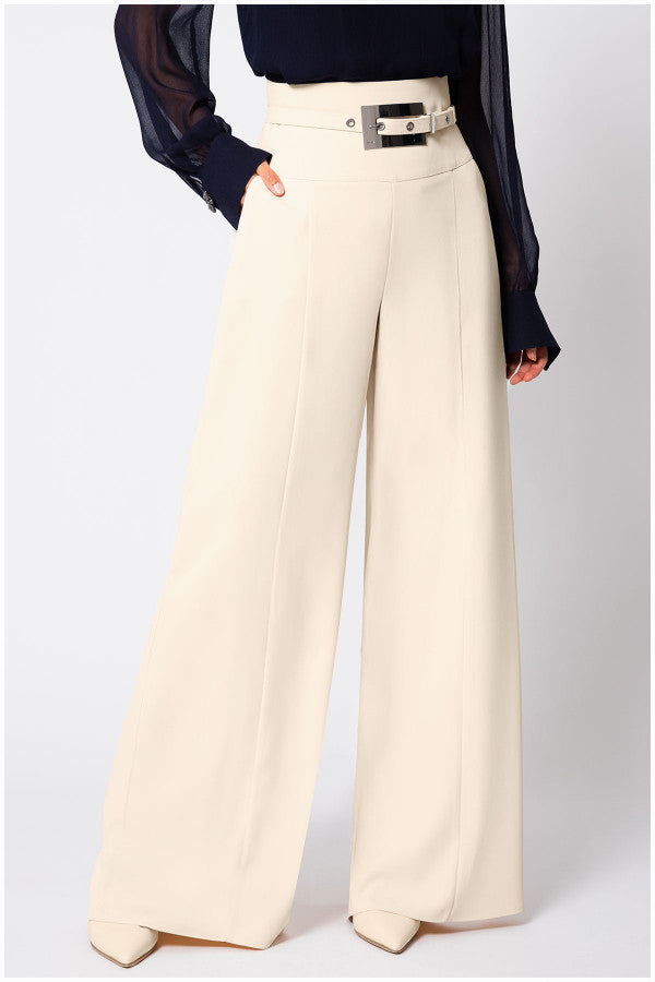 Beige wide-leg Luna Fashion House pants worn with a dark top on a white background