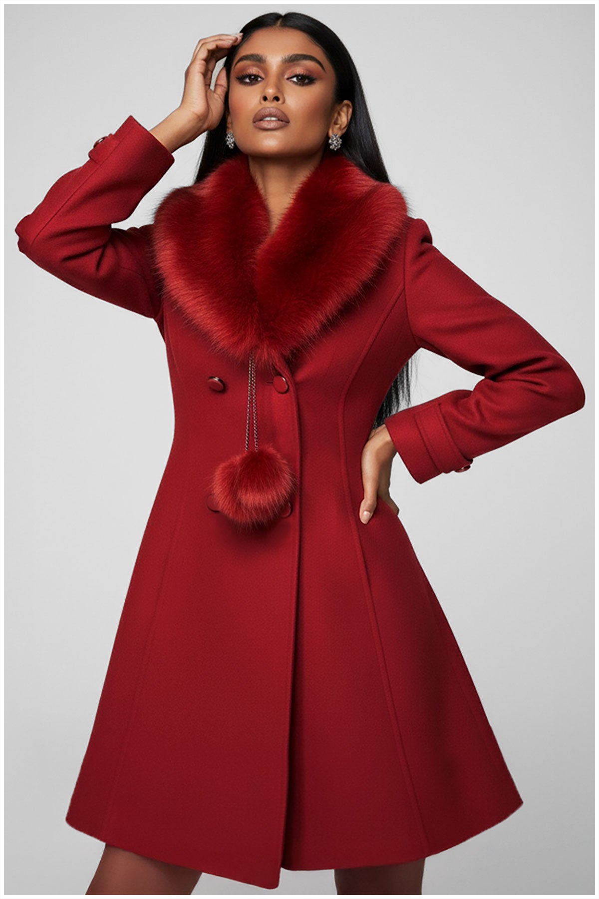 Red coat with fur collar worn by a model on a gray background