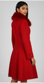 Red coat with fur hood worn by a model on a gray background