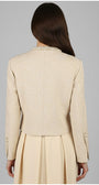 Beige Luna Fashion House suit jacket and skirt worn by a person on a gray background