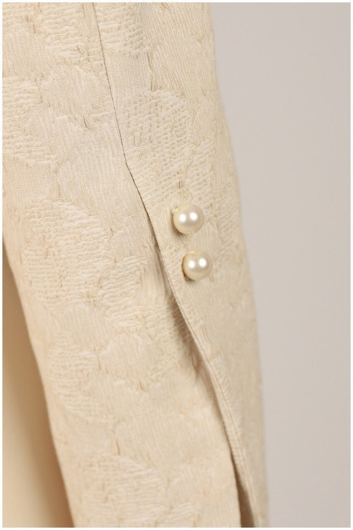 Ivory Jacquard Blazer with Pearl Details, Rhea. Close up of the pearl buttons on the jacquard.