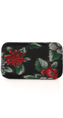 Floral patterned clutch bag on a white background