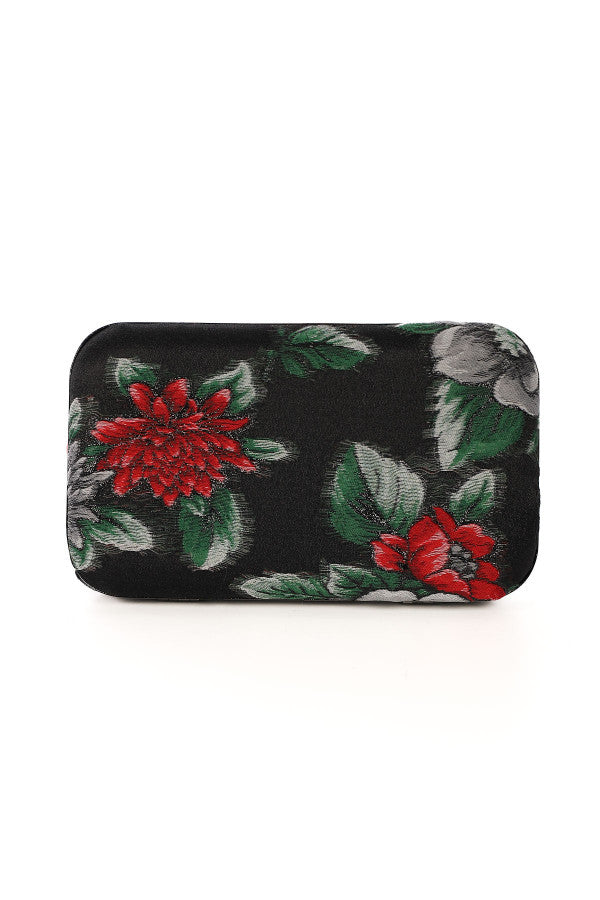 Floral patterned clutch bag on a white background