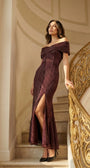 Bordeaux off-shoulder metallic gown on an ornate staircase under warm evening light