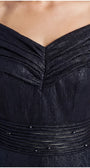 Close view of the navy gown's pleated off-shoulder neckline and beaded semi-sheer waistband