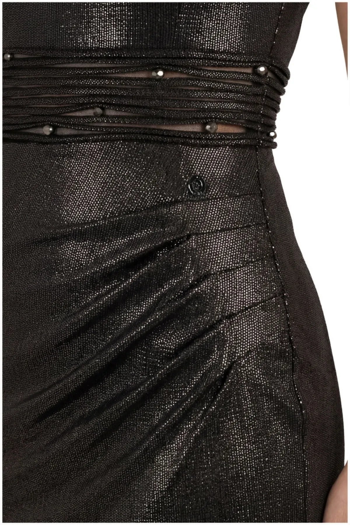 Close-up of the black metallic bodice with tiered sheer waist band set with small faceted dark crystals.