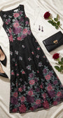 Rina cyclamen floral maxi dress styled flat with black pumps, black clutch, jewelry, and red roses.