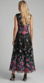 Back view of Rina cyclamen floral maxi dress showing the sleeveless bodice, back zipper, and A-line skirt.