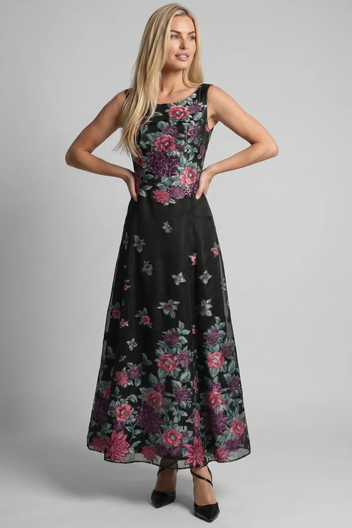 Rina cyclamen floral A-line maxi dress shown from the front with sleeveless bodice and rounded neckline.