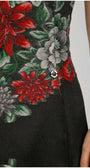 Close-up of red, grey, green floral embroidery on the Rina black dress with Luna button.