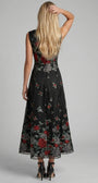 Back view of Rina black floral maxi dress with center zipper and floral hem placement.