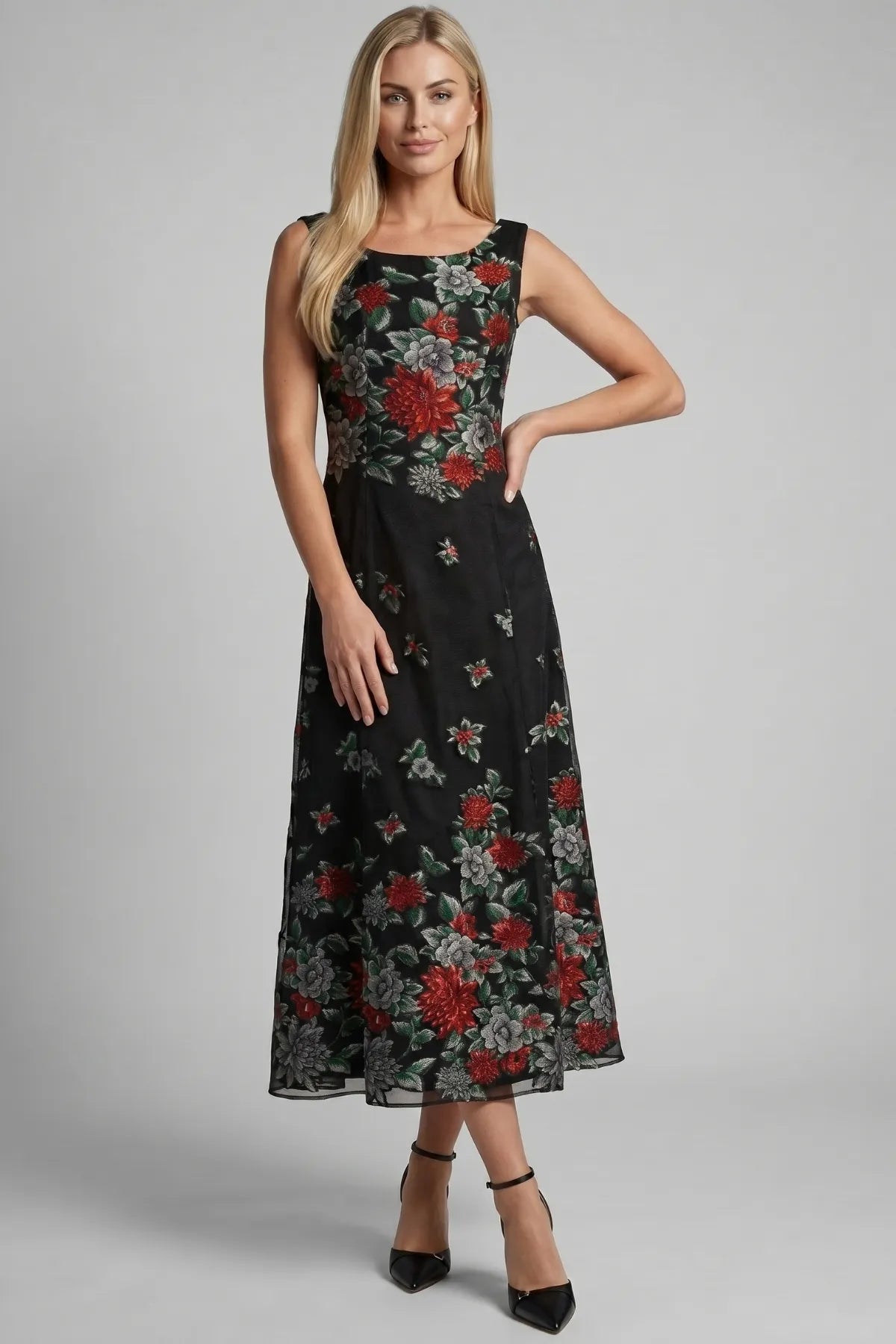 Rina black floral maxi dress shown from the front with sleeveless neckline and red, grey, green floral placement.