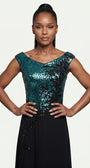 Close view of the teal sequined bodice, wide neckline, and black floral appliqué at the fitted waist