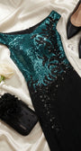 Greta gown styled with black heels, crystal jewelry, a white rose, and a black evening clutch on satin