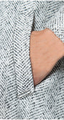 Close-up of a textured fabric with a brand label visible
