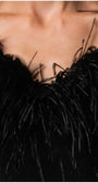 Close-up of the removable black ostrich-feather collar at the V-neckline.