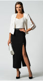 Woman wearing elegant white elegant blouse Dora Blouse with jeweled straps, paired with black slit skirt and white blazer.