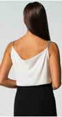 Back view of white elegant blouse Dora Blouse with jeweled straps and draped neckline worn with black skirt.
