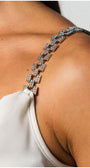 Close-up of white elegant blouse jeweled straps on Dora Blouse showcasing delicate satin fabric and elegant modern design.