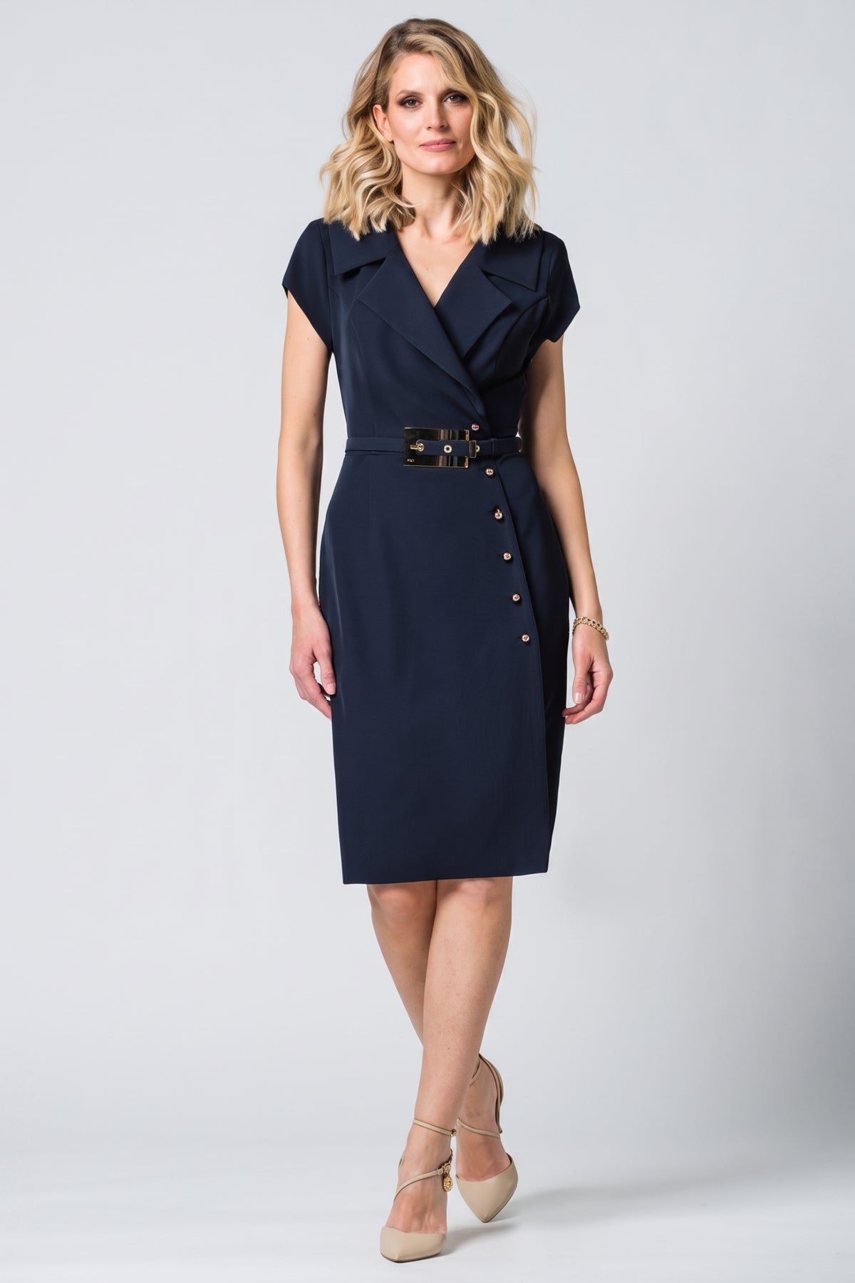 Navy Wrap Dress, Olga. Front view on the model, notched lapel collar and buckle belt.