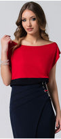 Woman wearing a red and black Top Greta with a sleek silhouette, pairing elegance and modern style by Luna Fashion House.
