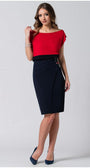 Woman wearing red and black Luna Fashion House’s Top Greta with a bold red bodice and sleek black waistline, styled with a pencil skirt