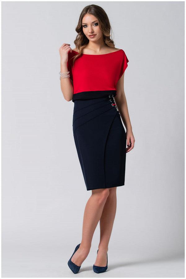 Woman wearing red and black Luna Fashion House’s Top Greta with a bold red bodice and sleek black waistline, styled with a pencil skirt