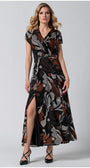 Woman wearing Long Dress Lola with deep V-neck and side slit in earthy bohemian print, posing against gray background