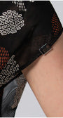 Close-up of Long Dress Lola fabric with earthy bohemian print and metal brand tag on lightweight black viscose blend.