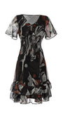 Flowing Short Dress Lola with deep V-neck, delicate tie, soft flounces, and abstract leaf pattern in black and rust tones.