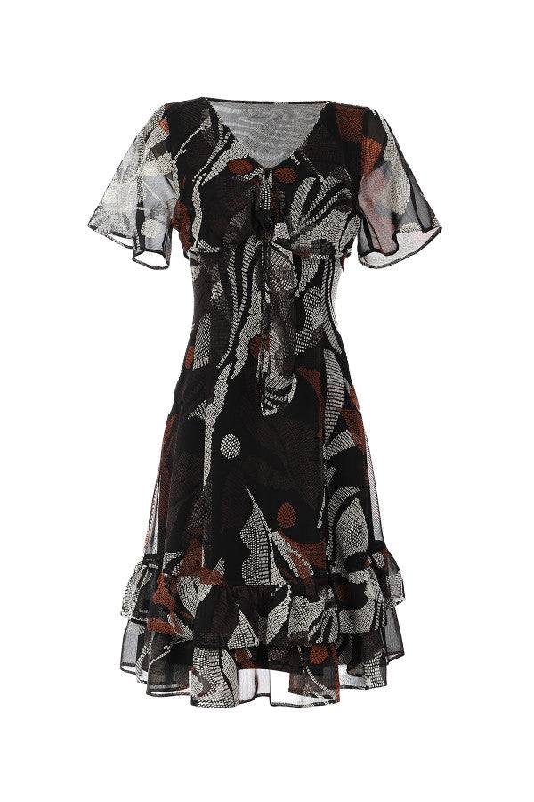 Flowing Short Dress Lola with deep V-neck, delicate tie, soft flounces, and abstract leaf pattern in black and rust tones.