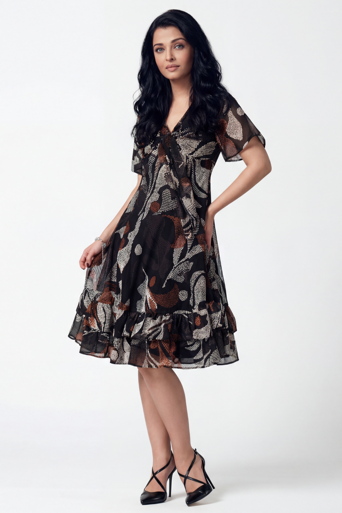 Woman wearing a patterned dress on a white background