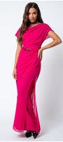 Woman wearing bright hot pink Overall Tina with belted waist and draped layered design posing on white background