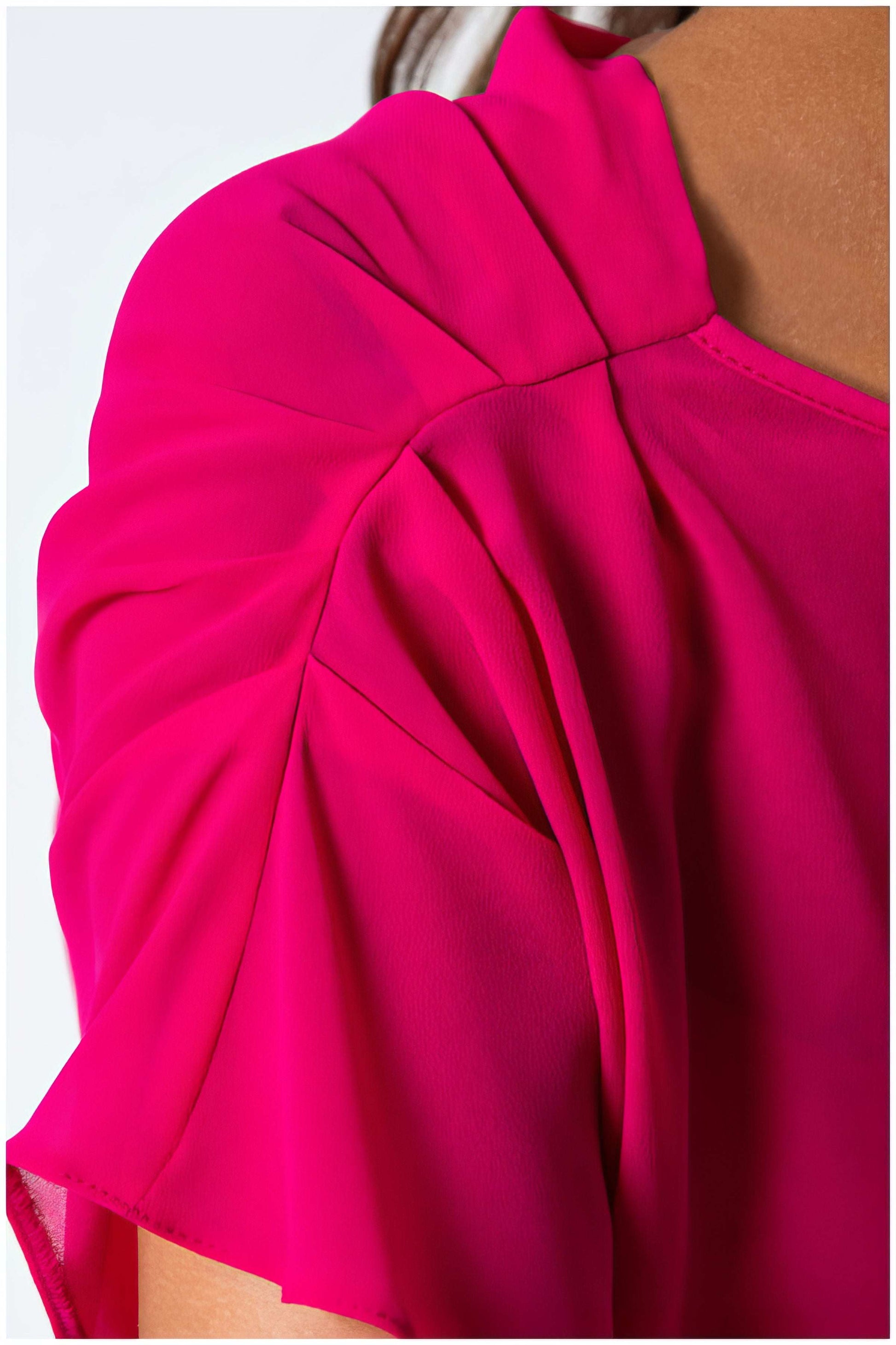 Close-up of vibrant fabric detail on the shoulder of Tina Overalls in Hot Pink by Luna Fashion House