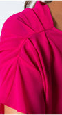 Close-up of the hot pink Overall Tina sleeve with elegant pleats and textured fabric detail