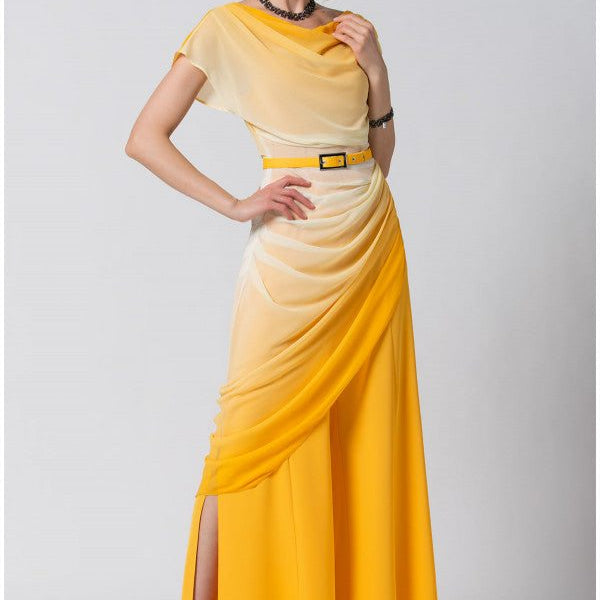 Woman wearing luminous ombre yellow Overall Tina with belted waist and subtle leg slit posing against plain background.