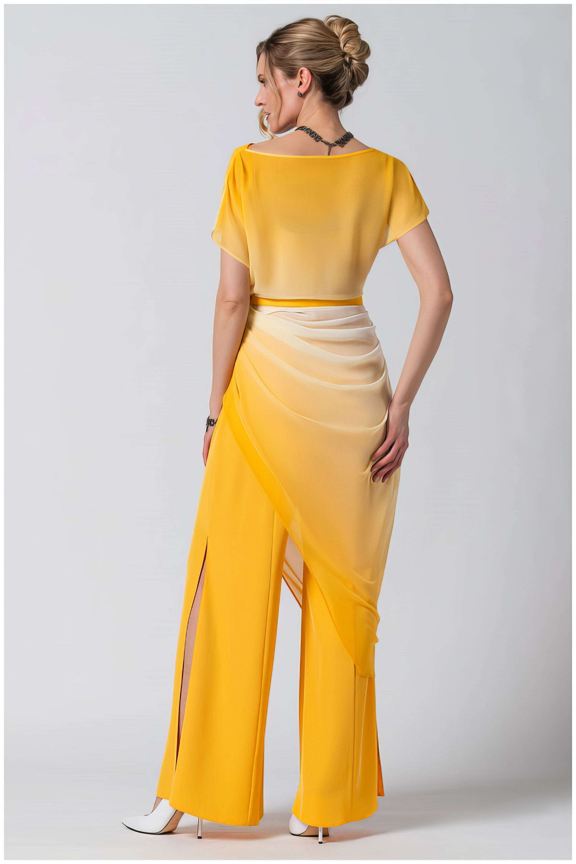 Woman wearing Tina Overalls in Yellow with an ombre design and side slits from Luna Fashion House shown from back