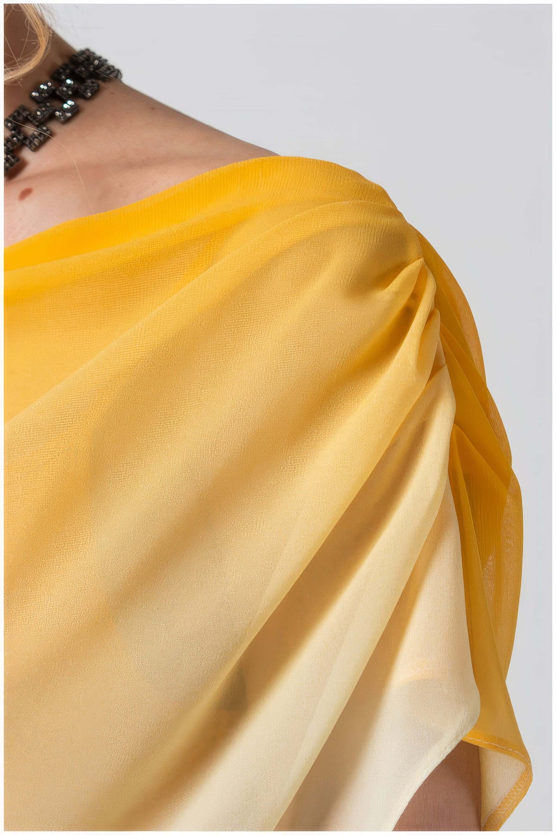 Close-up of the ombre yellow fabric detail on the shoulder of Tina Overalls in Yellow from Luna Fashion House