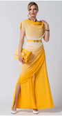 Woman wearing Tina Overalls in Yellow with ombre design, accessorized with matching clutch and white heels, posing confidently