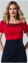 Woman in red office elegant blouse Lola Top with pleated neckline and short sleeves paired with a navy skirt.