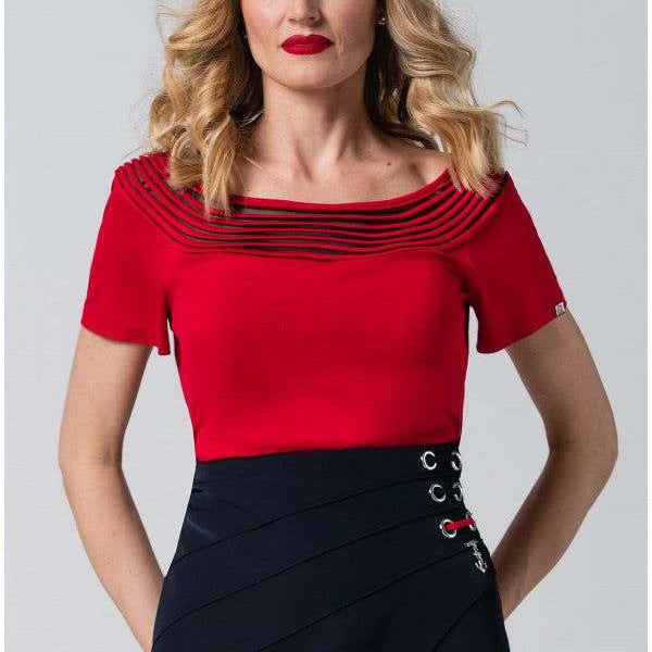 Woman in red office elegant blouse Lola Top with pleated neckline and short sleeves paired with a navy skirt.