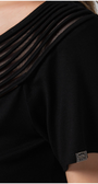Black garment with a brand logo on a blurred background