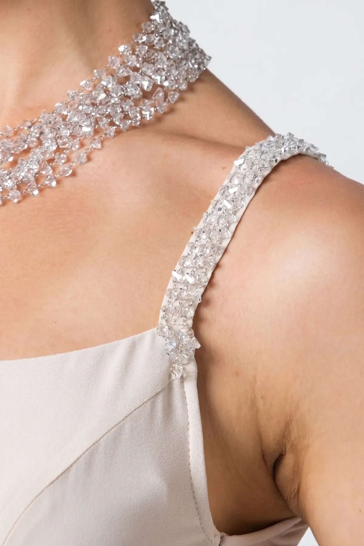 Close-up of the crystal-embellished spaghetti strap with hand-applied beading