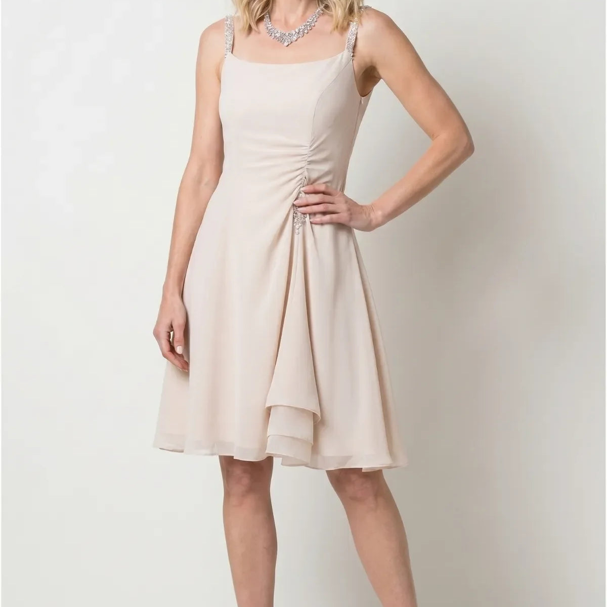 Beige Short Dress, Lesli. Short Dress in beige, model front view, crystal-embellished straps and side-gathered ruching with crystal drop.