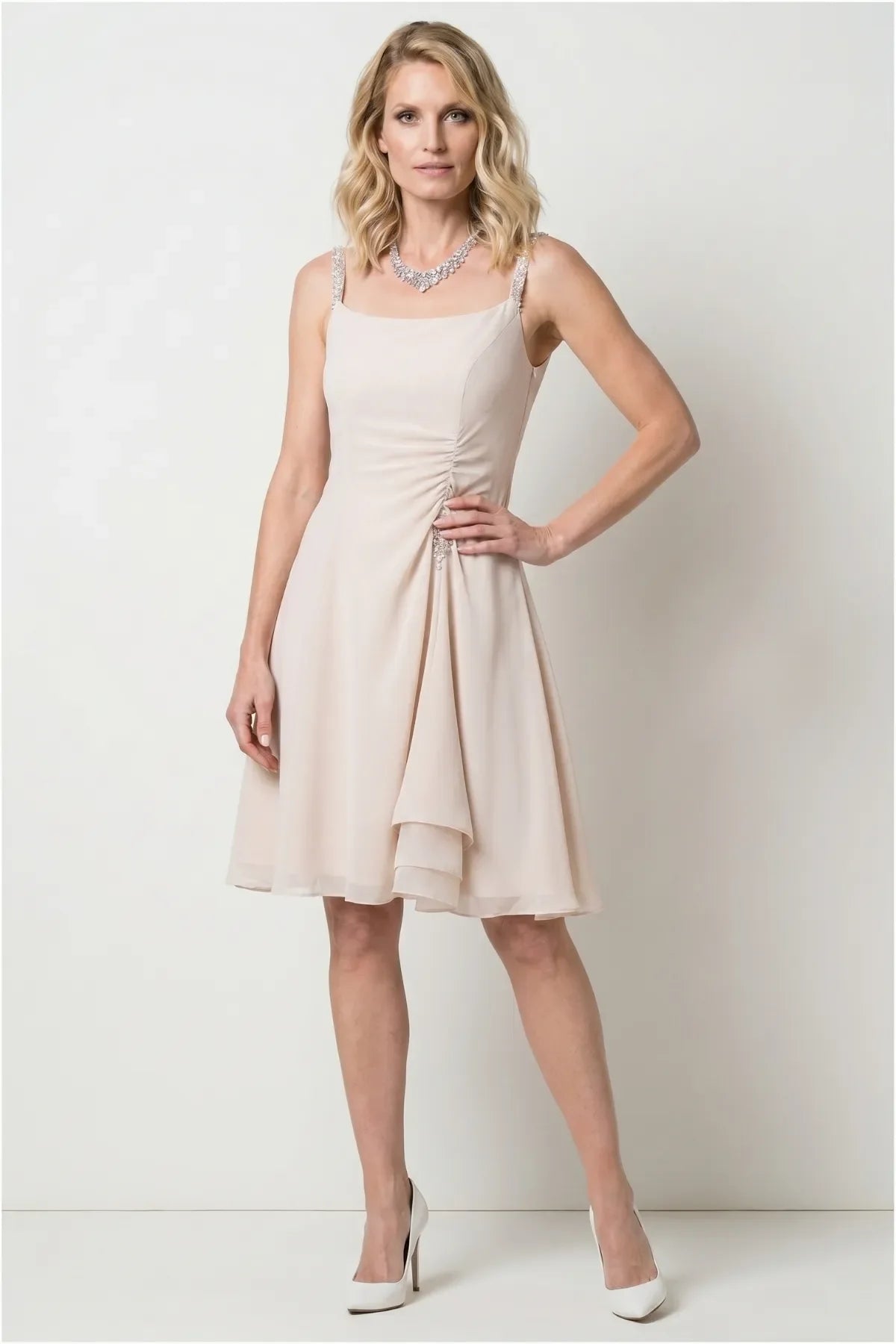 Lesli Short Dress in beige, model front view, crystal-embellished straps and side-gathered ruching with crystal drop