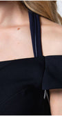 Close-up of Luna’s navy off-shoulder belted midi dress showing fabric texture and shoulder detail