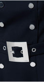 Close-up of navy belted off-shoulder elegant midi dress with silver square buckle and button details on fabric