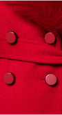 Close-up of a red coat with buttons and fur trim  Luna Fashion House design